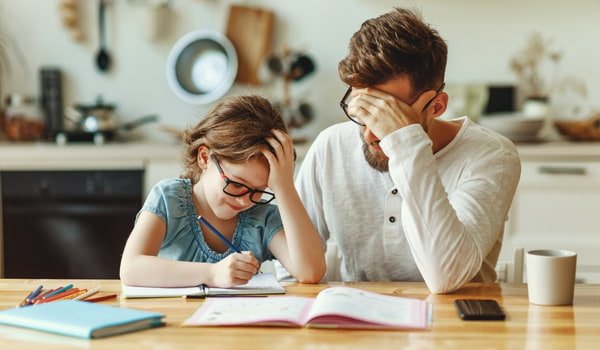 dad and daughter doing school
